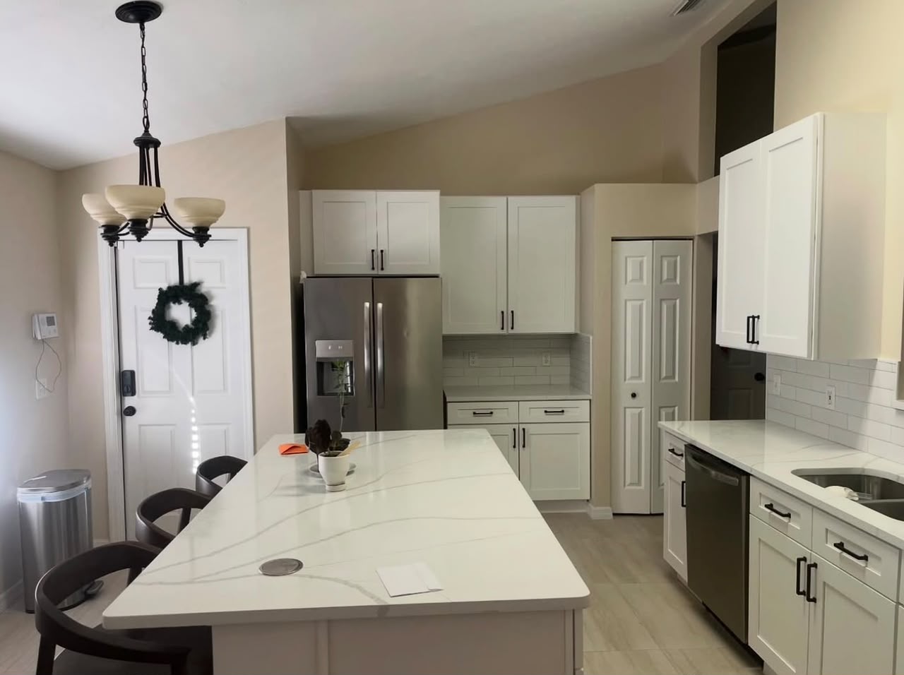 White shaker kitchen with waterfall island